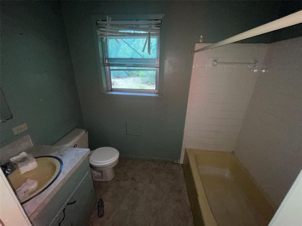 188 Pryor Street Rusk, TX 75785 - Photo 22 of 22 a bathroom with a sink and a toilet