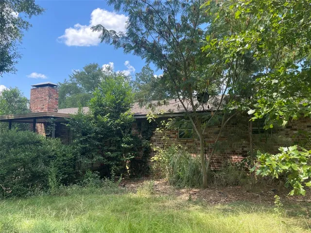 a view of a lake with a yard