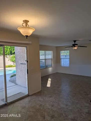 an empty room with windows and outdoor view