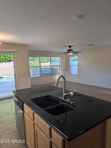 a kitchen that has a sink and a stove