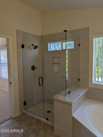 a bathroom with a shower and a sink