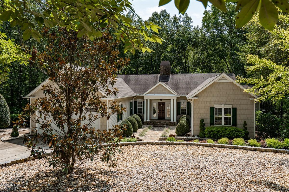 1934 Reedy Creek Road Forsyth, GA 31029 - Photo 1 of 51 a front view of a house with garden