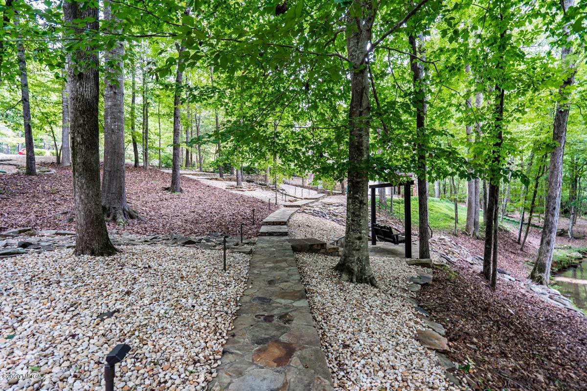 1934 Reedy Creek Road Forsyth, GA 31029 - Photo 11 of 51 a backyard of a house with lots of green space