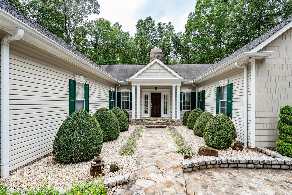 1934 Reedy Creek Road Forsyth, GA 31029 - Photo 15 of 51 a front view of a house with garden