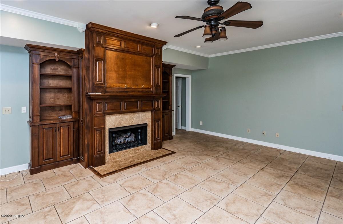 1934 Reedy Creek Road Forsyth, GA 31029 - Photo 21 of 51 a living room with furniture and a fireplace
