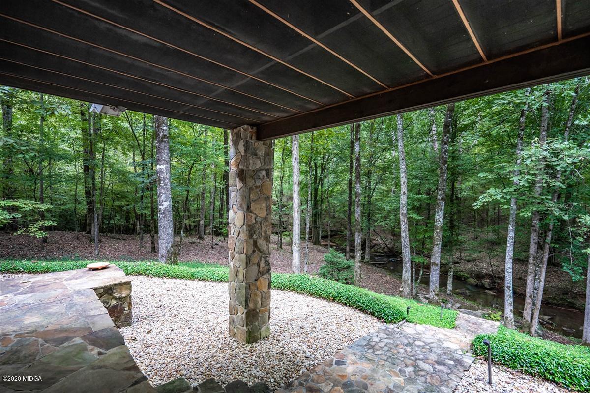 1934 Reedy Creek Road Forsyth, GA 31029 - Photo 29 of 51 a patio with a backyard table and chairs