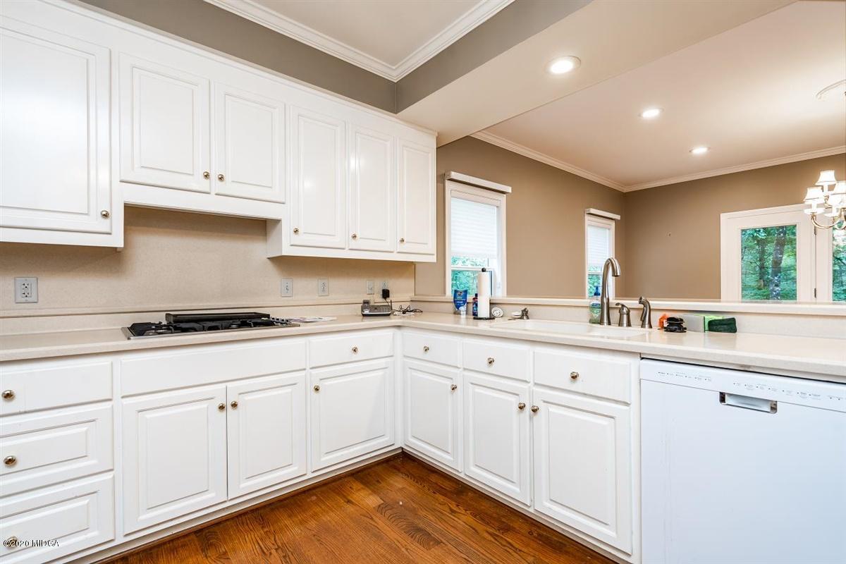 1934 Reedy Creek Road Forsyth, GA 31029 - Photo 36 of 51 a kitchen with granite countertop white cabinets and white appliances