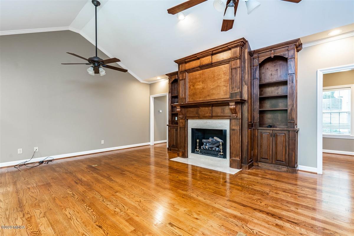 1934 Reedy Creek Road Forsyth, GA 31029 - Photo 40 of 51 a view of a livingroom with a fireplace a ceiling fan and window