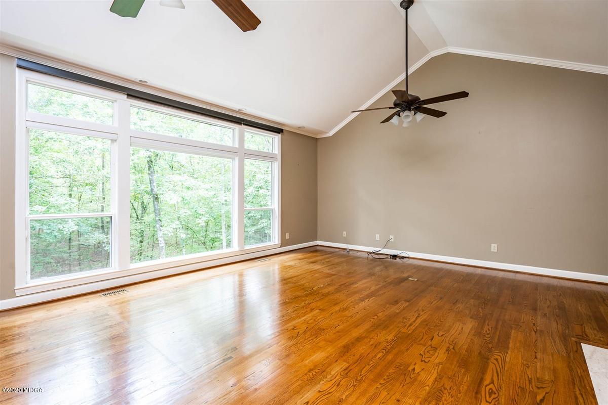 1934 Reedy Creek Road Forsyth, GA 31029 - Photo 41 of 51 a view of an empty room with wooden floor and a window
