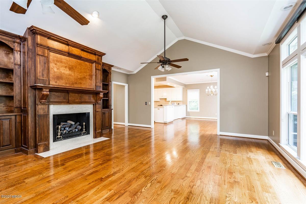 1934 Reedy Creek Road Forsyth, GA 31029 - Photo 42 of 51 a view of an empty room with window and fire place