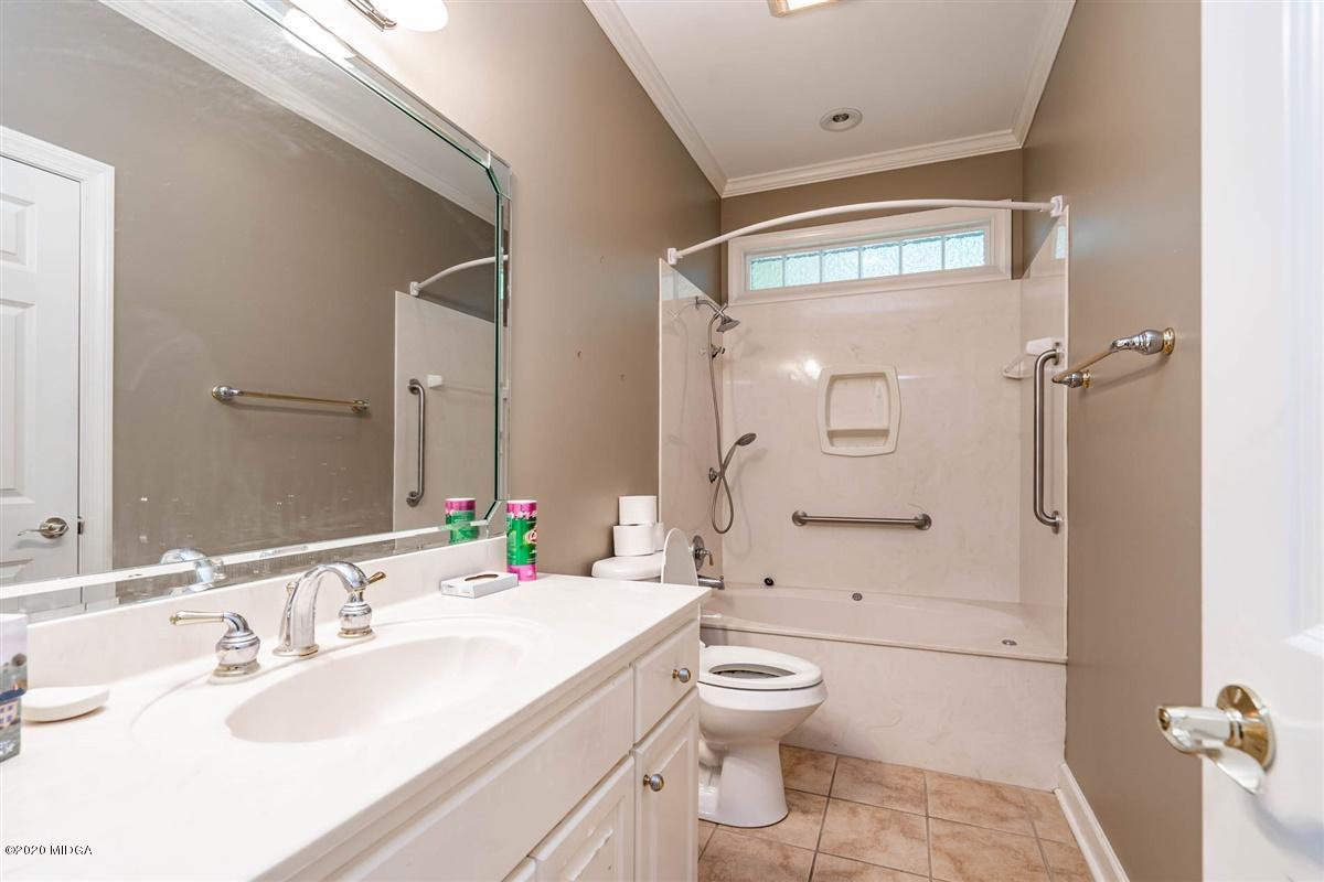 1934 Reedy Creek Road Forsyth, GA 31029 - Photo 48 of 51 a bathroom with a sink toilet tub and shower