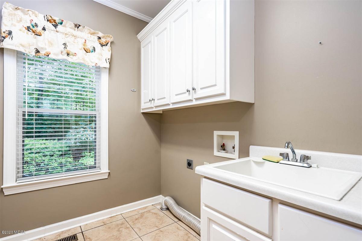1934 Reedy Creek Road Forsyth, GA 31029 - Photo 51 of 51 a bathroom with a sink and a window