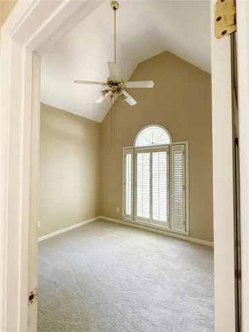 a bathroom with a granite countertop sink a mirror and a bathtub