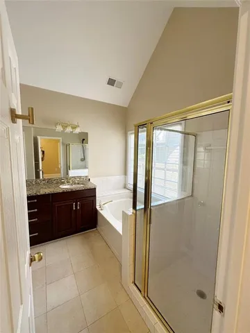 a view of an empty room with windows