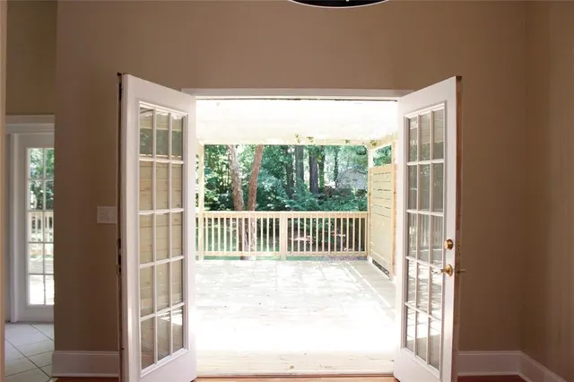 a view of a porch with a floor to ceiling window