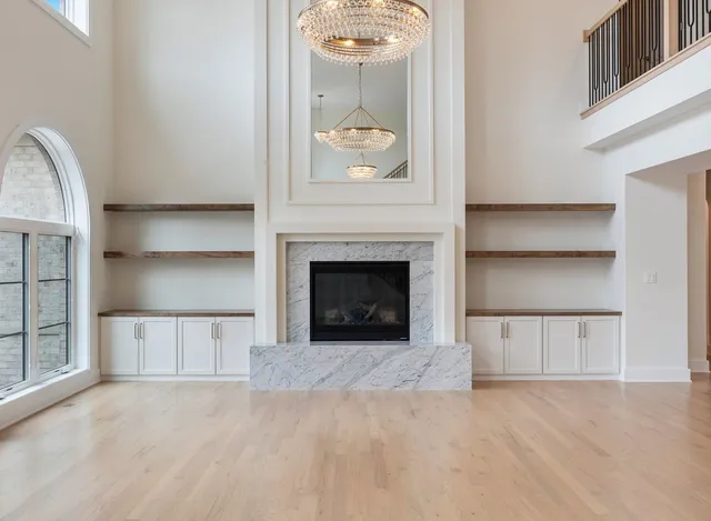 a kitchen with stainless steel appliances granite countertop a stove and a wooden floors