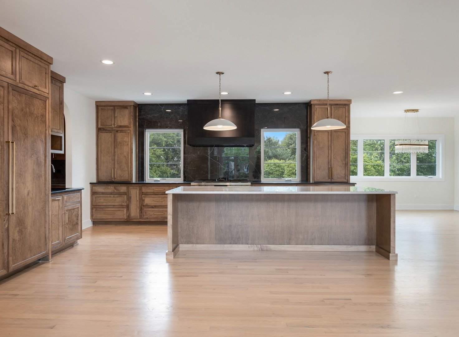 8886 Johnston Road Burr Ridge, IL 60527 - Photo 19 of 71 an open kitchen with large window and stainless steel appliances