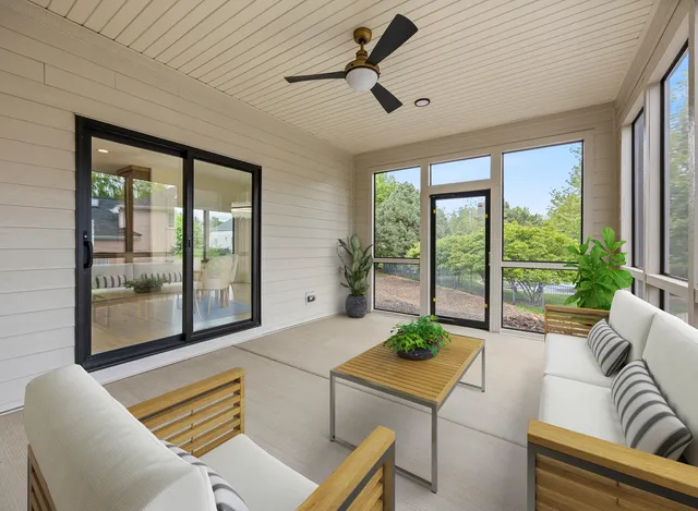 a bathroom with a granite countertop toilet sink and mirror