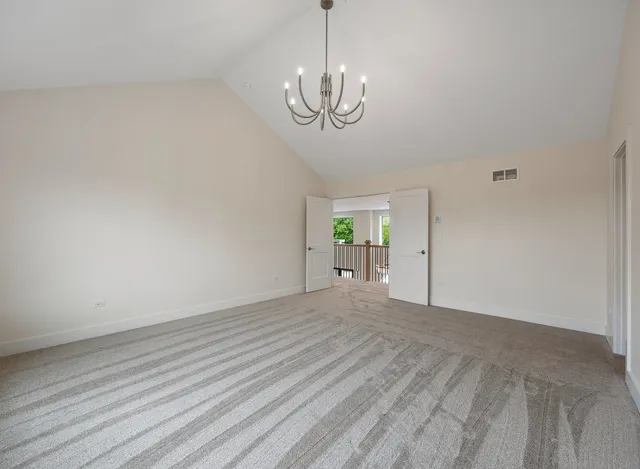 an aerial view of residential houses with outdoor space and street view