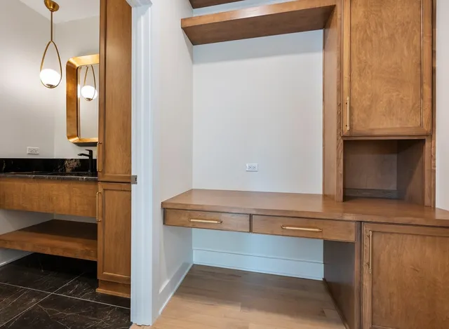 a room with gym equipment and view of living room