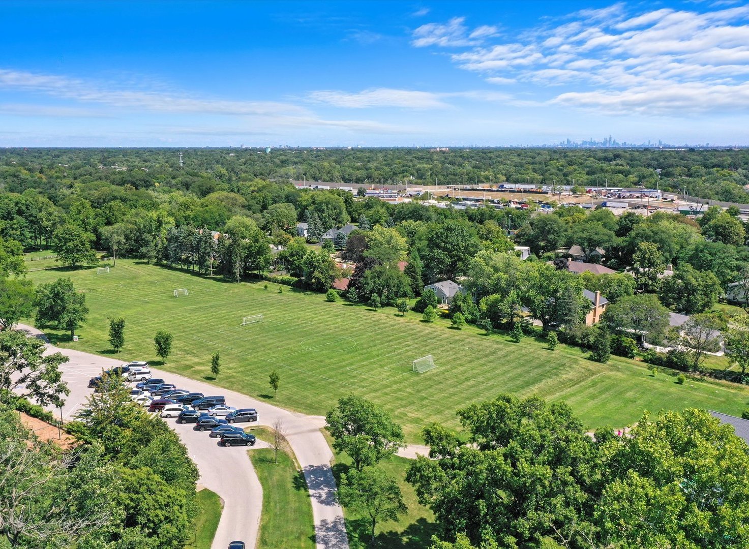 8886 Johnston Road Burr Ridge, IL 60527 - Photo 71 of 71 a view of a city with lush green forest