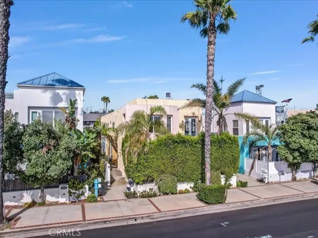 a front view of a building with garden