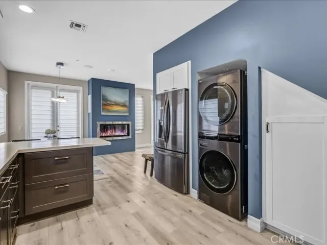 a kitchen with stainless steel appliances granite countertop a sink stove and microwave