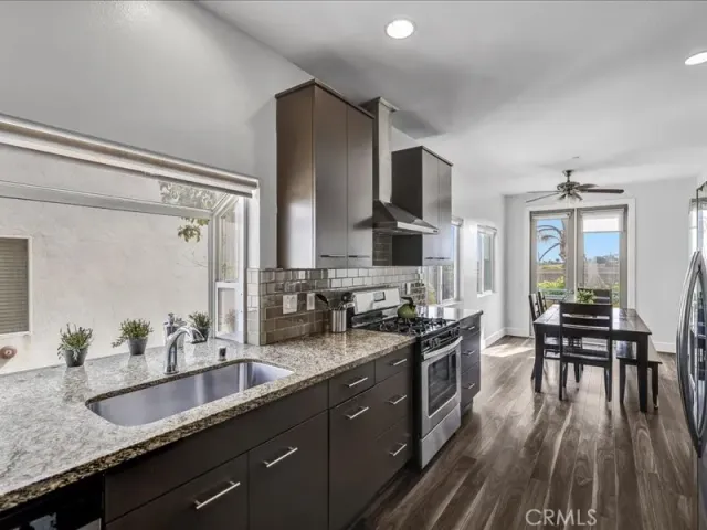 a white bed sitting in a bedroom next to a window