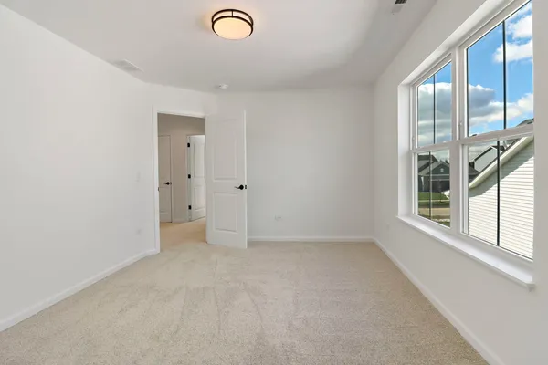 a view of empty room with a window