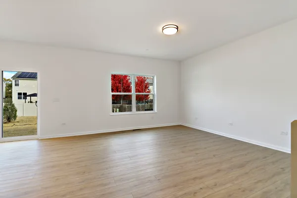 a view of an entryway with wooden floor