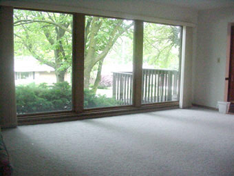 4948 Brookview Road Rockford, IL 61107 - Photo 4 of 5 a view of a room with large windows and yard