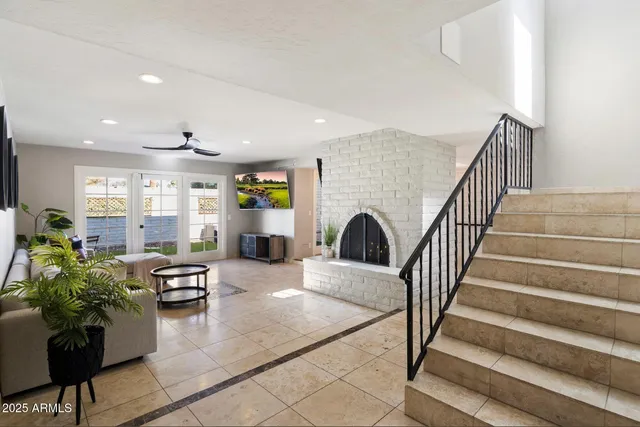 a living room with furniture or wooden floor and a potted plant