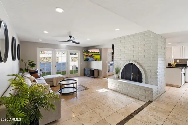 a living room with furniture and a fireplace