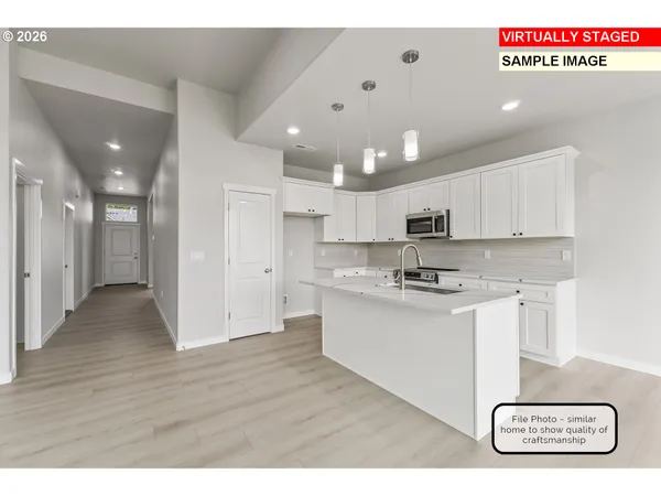 a kitchen that has a lot of counter space and a sink