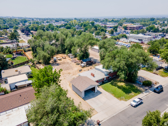120 Cox Lane Midvale, UT 84047 - Photo 4 of 13 Expansive lot featuring a detached garage, established trees, and surrounding neighborhood infrastructure
