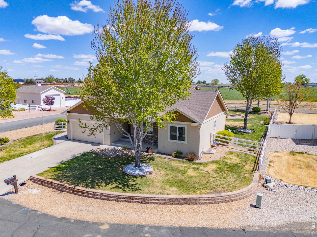 2002 Trail Ridge Drive Severance, CO 80615 - Photo 6 of 49 Situated on a private corner lot in a quiet cul-de-sac, this property backs to farm ground offering a peaceful, tucked-away feeling while still being conveniently close to town and ample amenities.