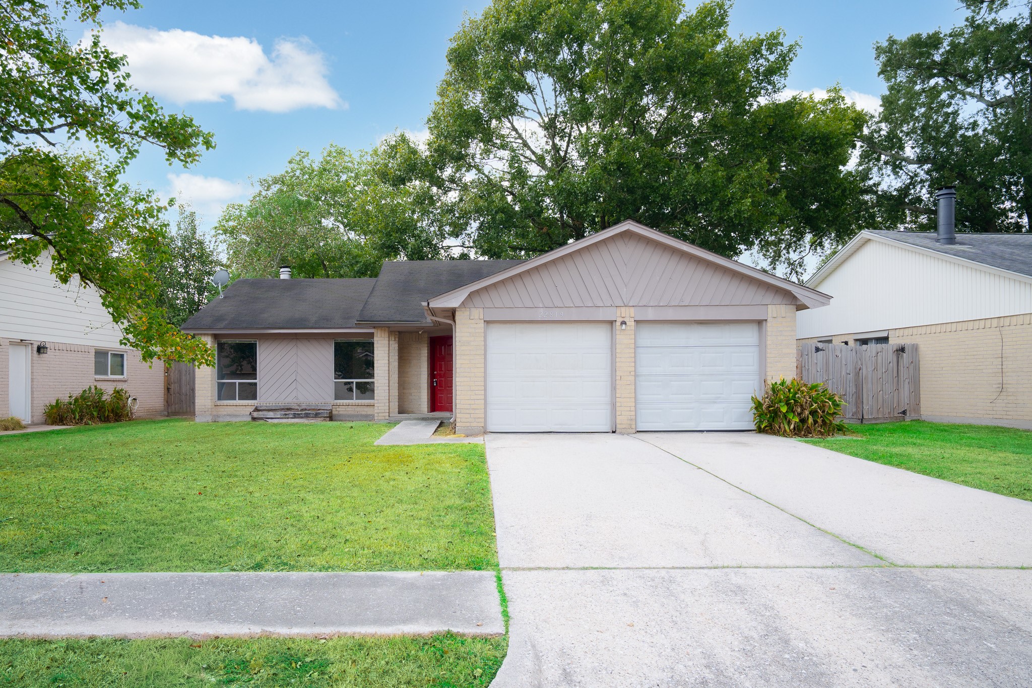 22819 Carter Gate Drive Spring, TX 77373 - Photo 1 of 15 a front view of a house with a yard and garage