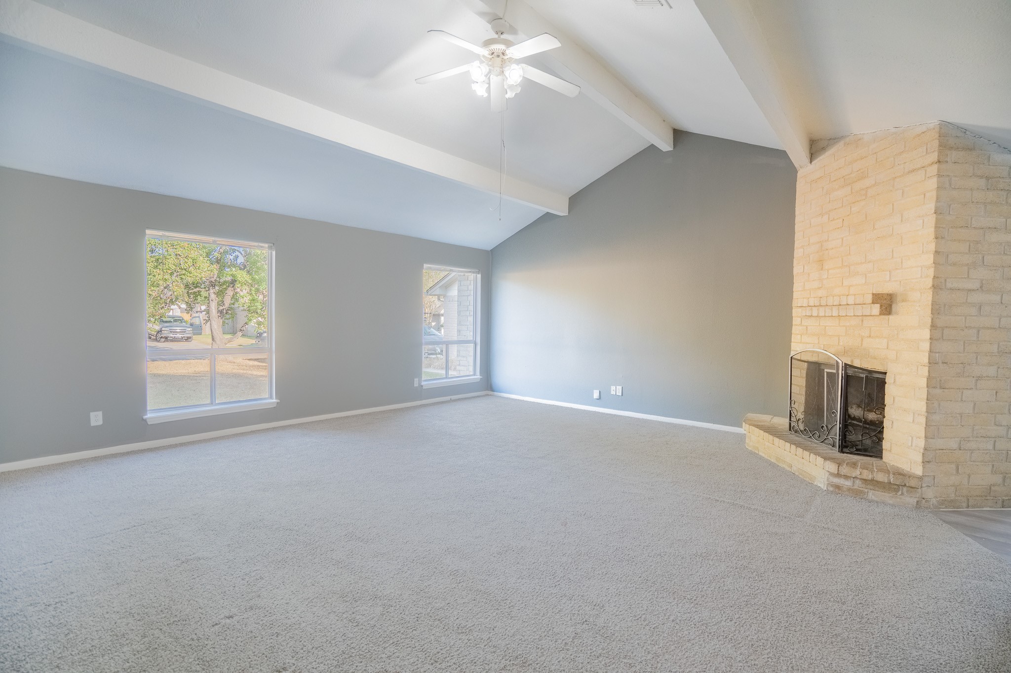 22819 Carter Gate Drive Spring, TX 77373 - Photo 3 of 15 an empty room with windows and chandelier fan