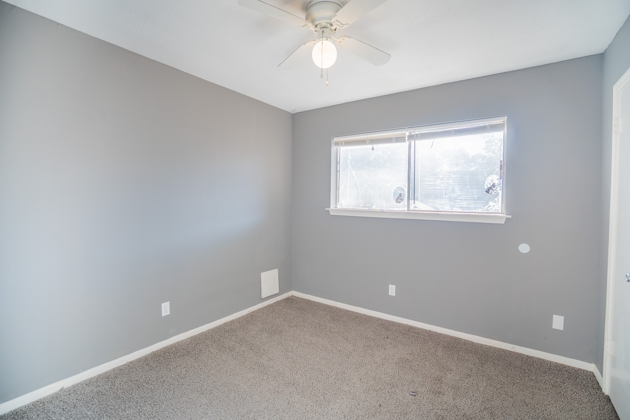22819 Carter Gate Drive Spring, TX 77373 - Photo 7 of 15 an empty room with a window and a fan