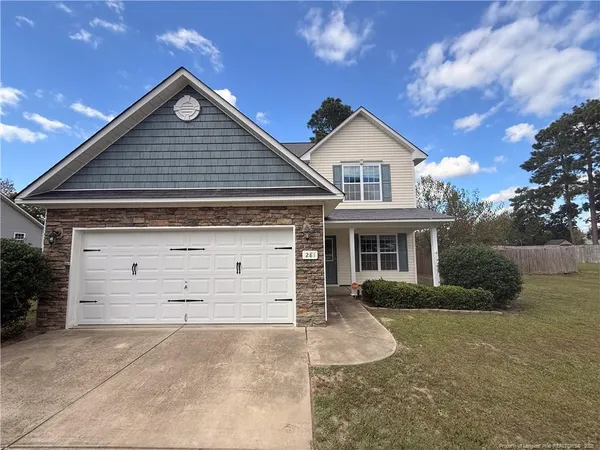 front view of a house with a yard