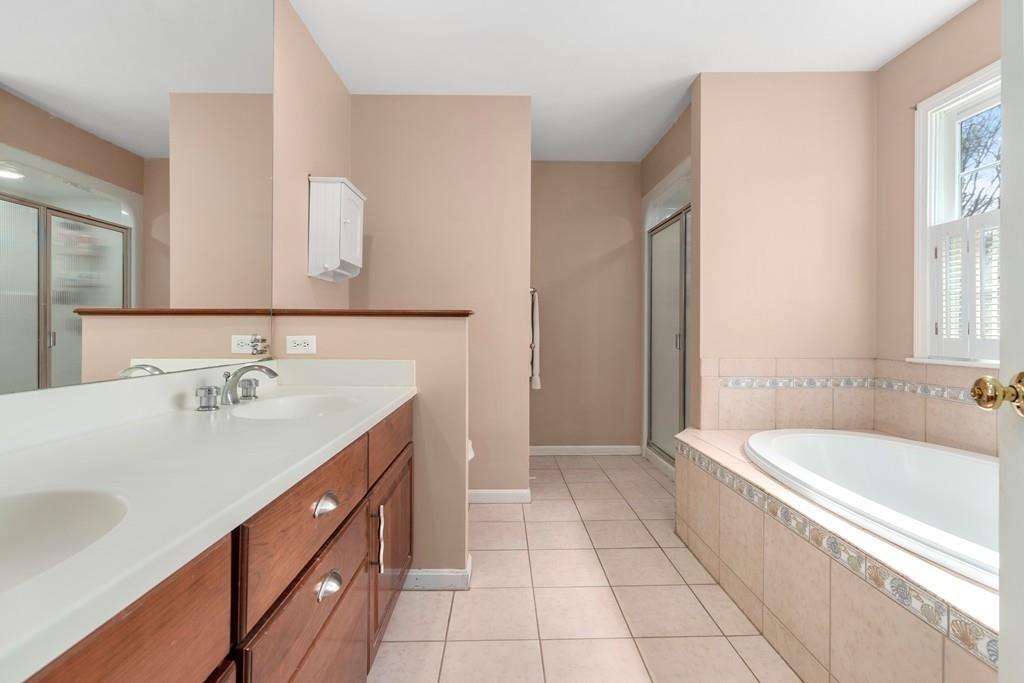 242 Old Stonebridge Road Wayland, MA 01778 - Photo 11 of 19 a bathroom with a tub sink and mirror