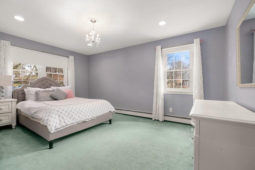 242 Old Stonebridge Road Wayland, MA 01778 - Photo 12 of 19 a spacious bedroom with a bed and a window