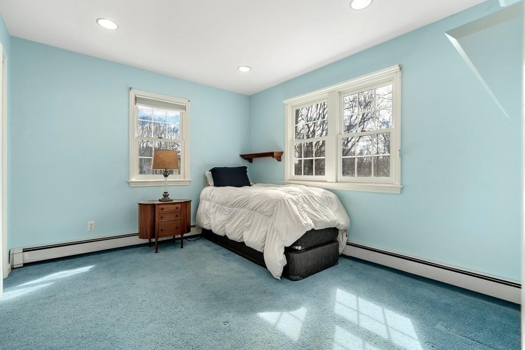 242 Old Stonebridge Road Wayland, MA 01778 - Photo 13 of 19 a bed sitting in a bedroom next to a window