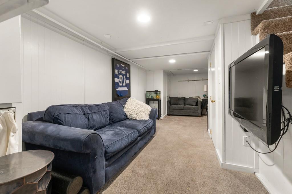 242 Old Stonebridge Road Wayland, MA 01778 - Photo 14 of 19 a living room with furniture and a flat screen tv