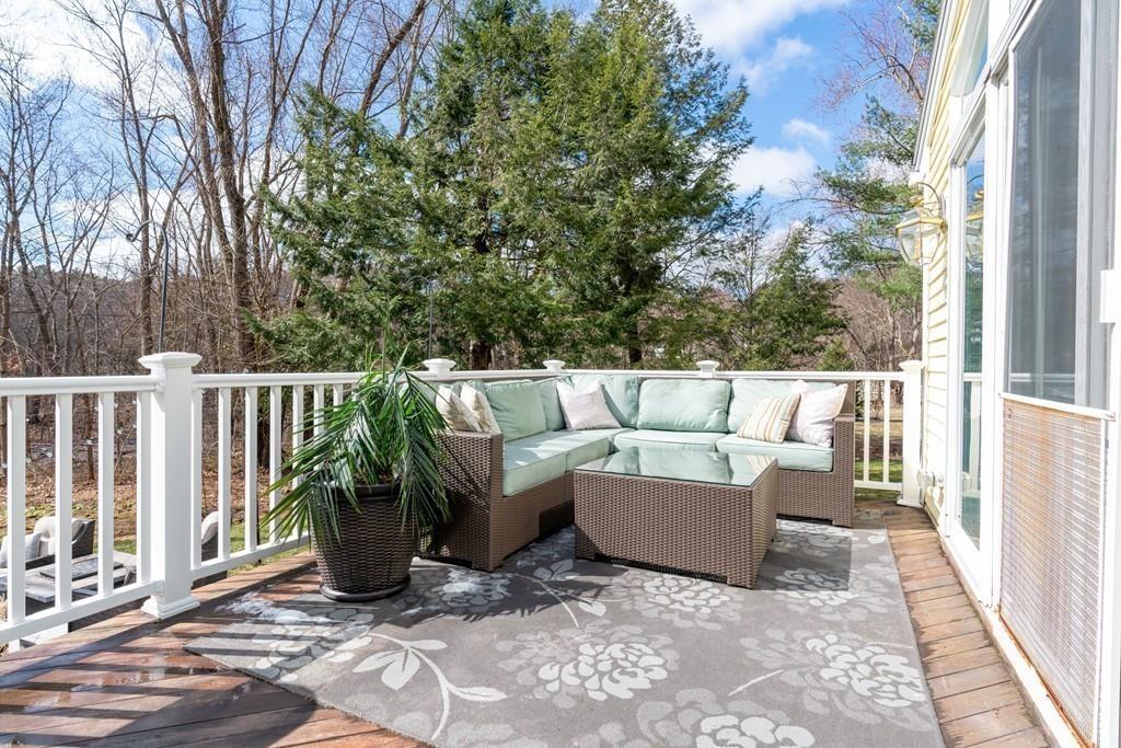 242 Old Stonebridge Road Wayland, MA 01778 - Photo 17 of 19 a view of a deck with couches and wooden fence
