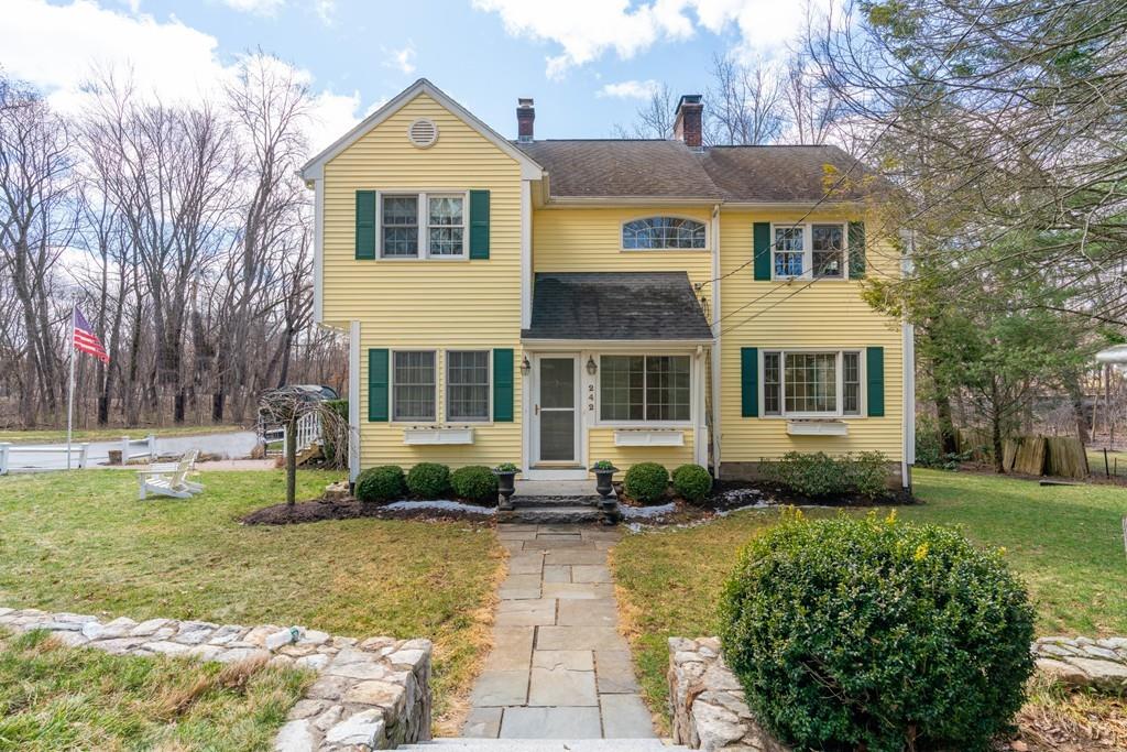 242 Old Stonebridge Road Wayland, MA 01778 - Photo 2 of 19 a front view of a house with garden
