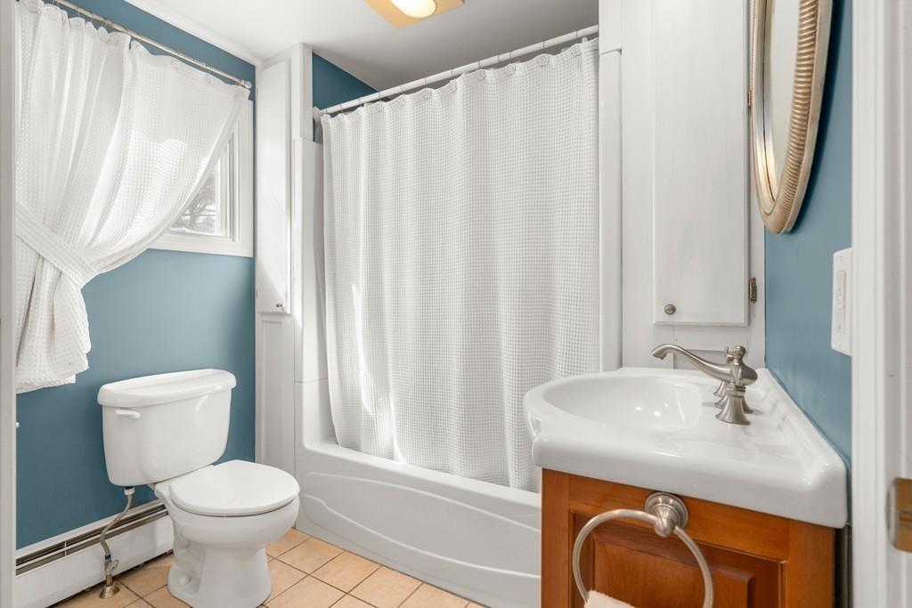 242 Old Stonebridge Road Wayland, MA 01778 - Photo 9 of 19 a bathroom with a sink a toilet and a mirror