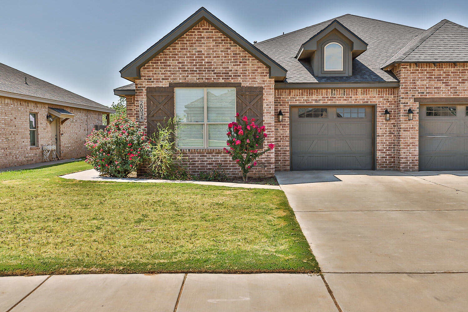 2005 102nd Street, Unit B Lubbock, TX 79423 - Photo 1 of 16 a front view of a house