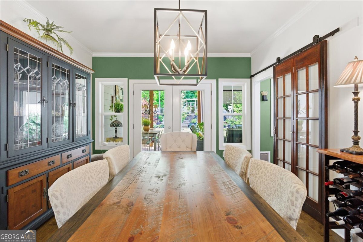 731 Markhams Drive Madison, GA 30650 - Photo 17 of 68 a spacious bedroom with a bed and a large window