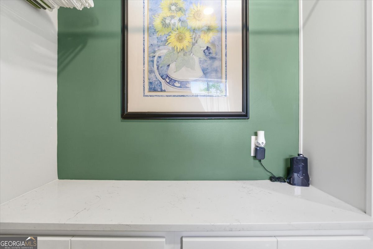 731 Markhams Drive Madison, GA 30650 - Photo 21 of 68 a bathroom with a bathtub and vanity